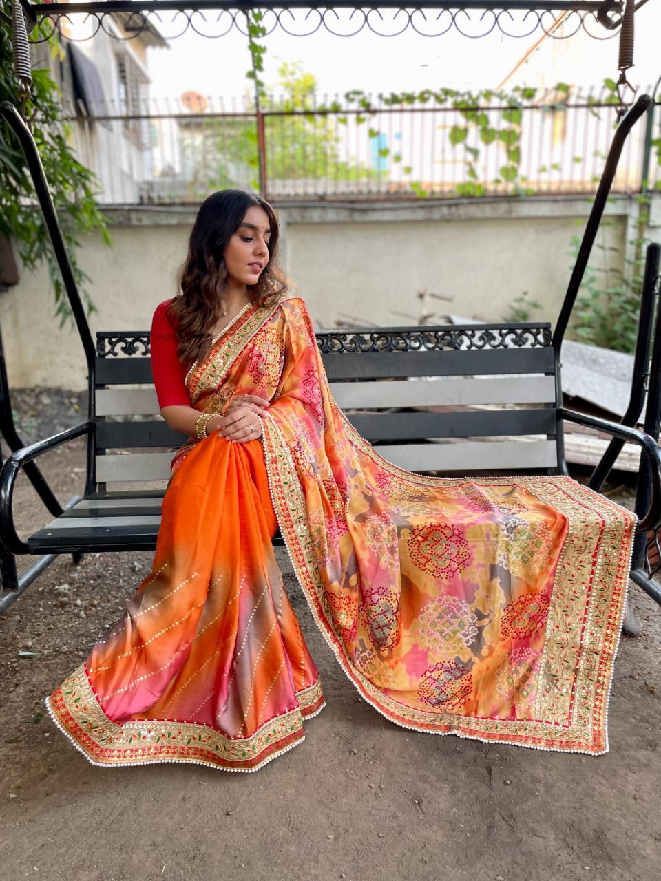 Orange color dola silk saree with printed and sequence work